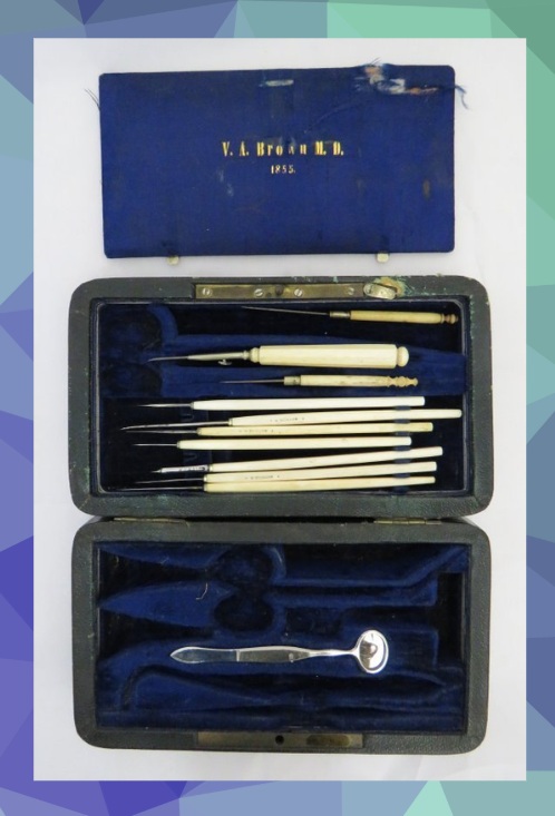 V.A. Brown 1855 blue velvet medical case full of tiny eye surgery tools with ivory handles.